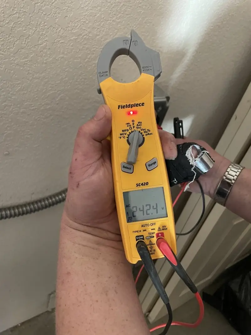 Voltage testing with clamp meter during Hot Tub / Pool Electrical Wiring in Blue Springs